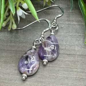 Shop Amethyst Earrings! Peace and Clarity Dangle Earrings | Genuine Amethyst Teardrop Earrings | French Hook Sterling Ear Wires | Natural genuine Amethyst earrings. Buy crystal jewelry, handmade handcrafted artisan jewelry for women.  Unique handmade gift ideas. #jewelry #beadedearrings #beadedjewelry #gift #shopping #handmadejewelry #fashion #style #product #earrings #affiliate #ad