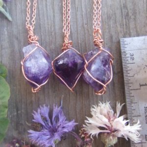A perfect little  purple Amethyst crystal point wrapped in pure copper with a real leather chord raw natural, amethyst pendant, amethyst nec | Natural genuine Amethyst pendants. Buy crystal jewelry, handmade handcrafted artisan jewelry for women.  Unique handmade gift ideas. #jewelry #beadedpendants #beadedjewelry #gift #shopping #handmadejewelry #fashion #style #product #pendants #affiliate #ad