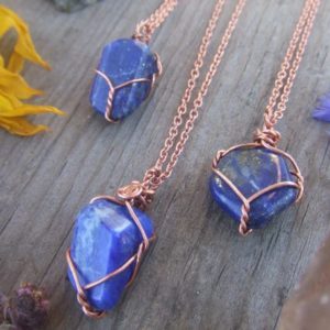 natural small lapis lazuli crystal wire wrapped pendant, copper or silver wrap, necklace adjustable leather chord or copper chain dark blue | Natural genuine Gemstone pendants. Buy crystal jewelry, handmade handcrafted artisan jewelry for women.  Unique handmade gift ideas. #jewelry #beadedpendants #beadedjewelry #gift #shopping #handmadejewelry #fashion #style #product #pendants #affiliate #ad