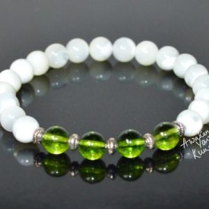 Shop Peridot Bracelets! Peridot and Mother of Pearl Bracelet, Healing Crystal Peridot & Pearl Bracelet for Men and Women | Natural genuine Peridot bracelets. Buy handcrafted artisan men's jewelry, gifts for men.  Unique handmade mens fashion accessories. #jewelry #beadedbracelets #beadedjewelry #shopping #gift #handmadejewelry #bracelets #affiliate #ad