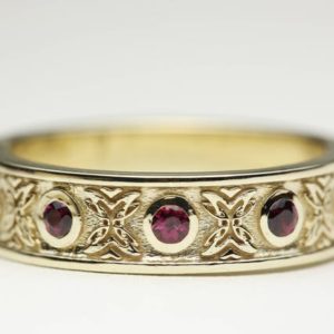 Shop Ruby Rings! Celtic Wedding Ring, Ruby Wedding Band, Ruby Eternity Ring, Celtic Gold Ring | Natural genuine Ruby rings, simple unique alternative gemstone engagement rings. #rings #jewelry #bridal #wedding #jewelryaccessories #engagementrings #weddingideas #affiliate #ad