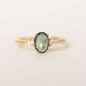 Shop Sapphire Rings! Green Sapphire Engagement Ring | Oval Engagement Ring | 3 Stone Rose Gold Ring | Oval Rose Cut Sapphire | Trilogy Ring [the Amelia Ring] | Natural genuine Sapphire rings, simple unique alternative gemstone engagement rings. #rings #jewelry #bridal #wedding #jewelryaccessories #engagementrings #weddingideas #affiliate #ad