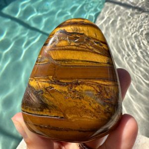 Shop Tiger Eye Shapes! XL  tiger eye palmstone, courage, power, protection, palm stone | Natural genuine stones & crystals in various shapes & sizes. Buy raw cut, tumbled, or polished gemstones for making jewelry or crystal healing energy vibration raising reiki stones. #crystals #gemstones #crystalhealing #crystalsandgemstones #energyhealing #affiliate #ad