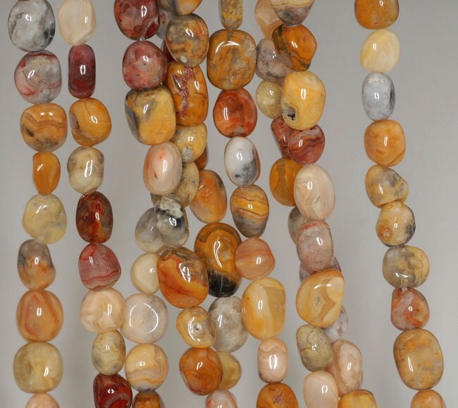 Crazy Lace Agate Gemstone Pebble 12x7-7x7mm Loose Beads 7.5 Inch Half Strand (90191886-b64) Crazy Lace Agate Gemstone Pebble 12x7-7x7mm Loose Beads 7.5 Inch Half Strand (90191886-b64)