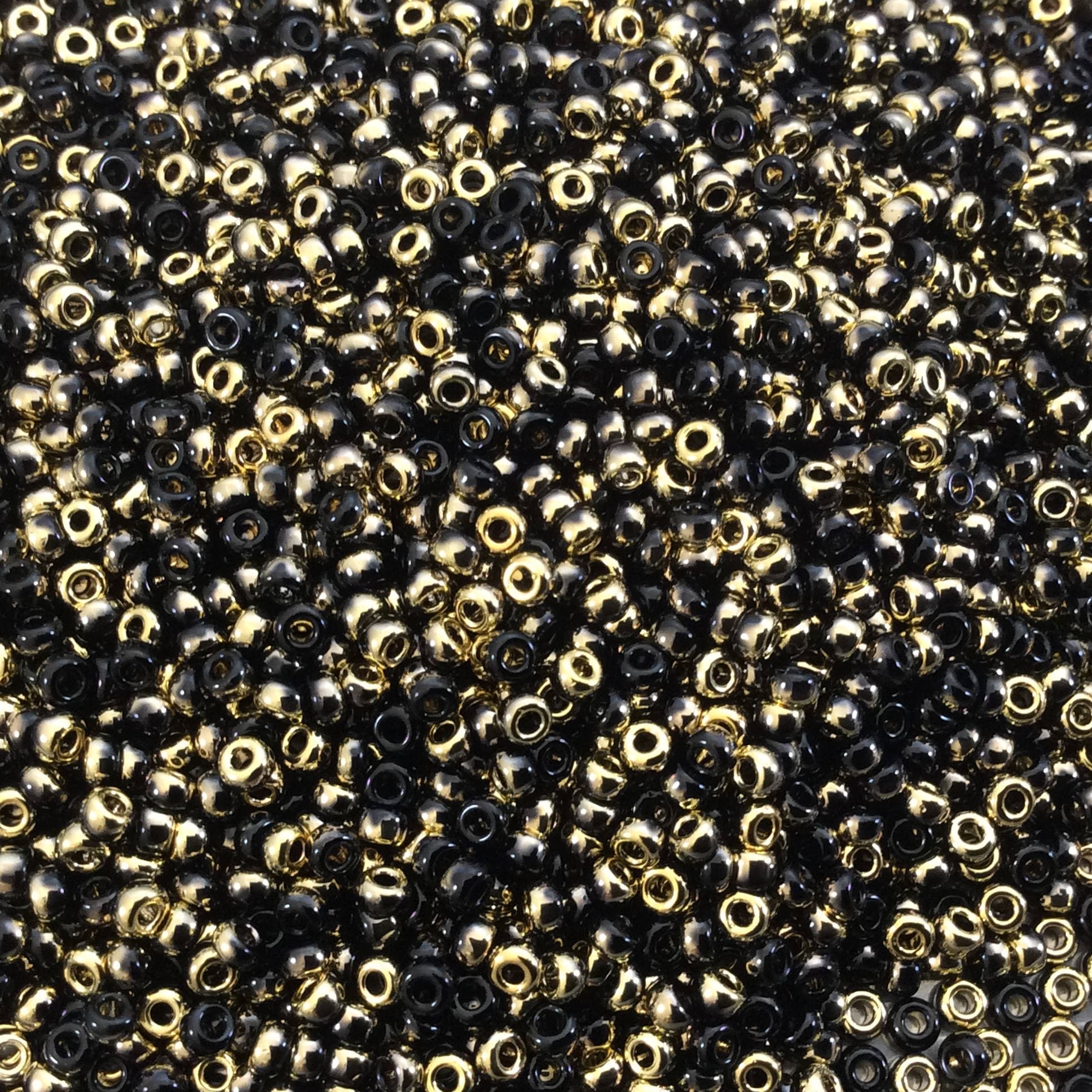Miyuki Seed Beads 11/0: Glossy Black-base Amber, 24 Gram Tube Miyuki Seed Beads 11/0: Glossy Black-base Amber, 24 Gram Tube