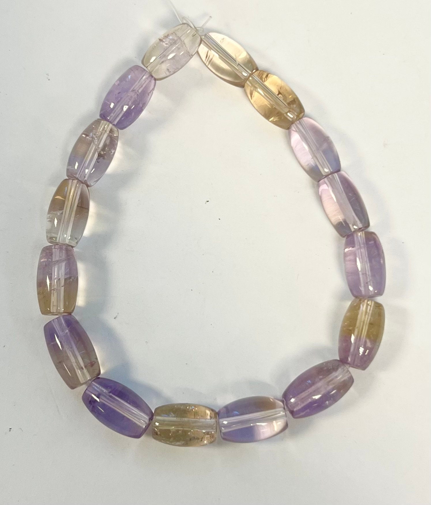Ametrine 12x7mm Oval Gemstone Beads -- 7 Inch Strand Ametrine 12x7mm Oval Gemstone Beads -- 7 Inch Strand