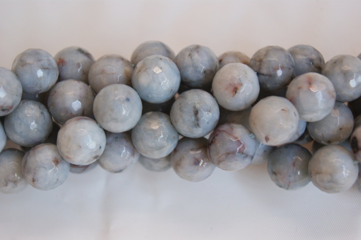 Angelite 6mm Faceted Round Shaped Gemstone -- 15.5 Inch Strand Angelite 6mm Faceted Round Shaped Gemstone -- 15.5 Inch Strand