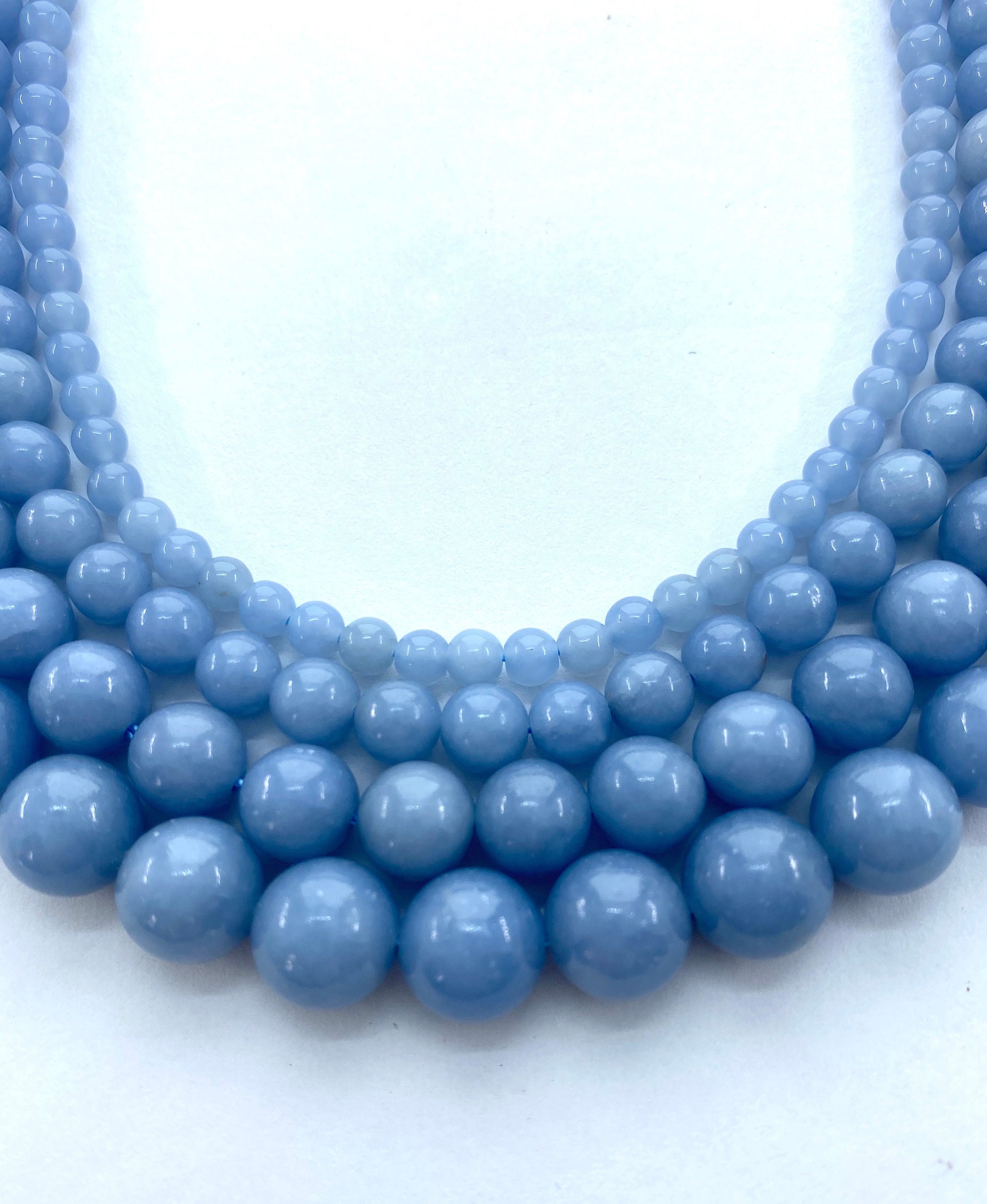 Angelite Gemstone Beads. 15” Strands Of Round High Quality Angelite Beads, Available In 4-10mm. Also Called Blue Angel. Opaque Baby Blue. Angelite Gemstone Beads. 15” Strands Of Round High Quality Angelite Beads, Available In 4-10mm. Also Called Blue Angel. Opaque Baby Blue.