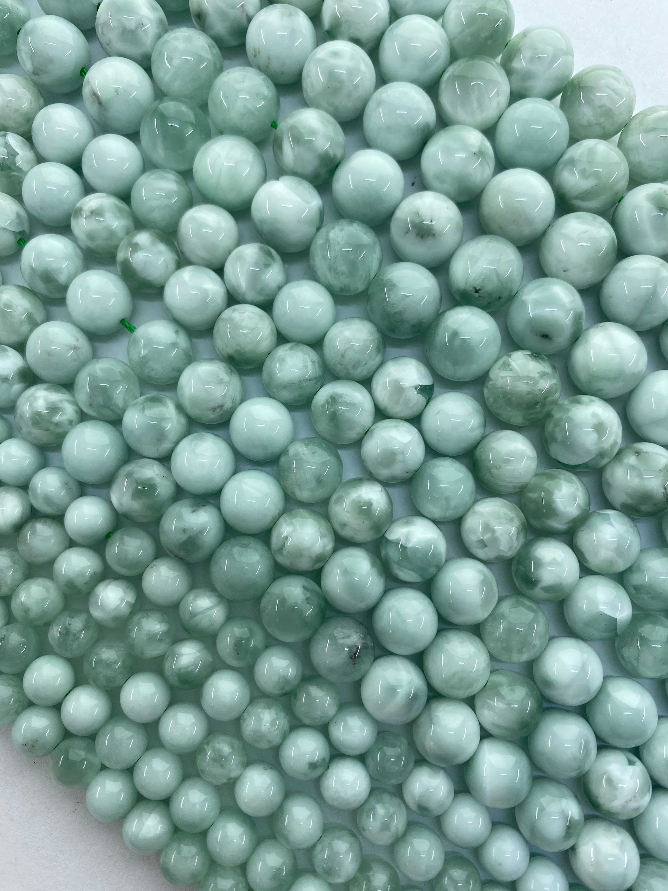 Green Angelite Gemstone Beads. 15” Strands Of Round Natural High Quality Angelite Beads, Available In 6-10mm. Soft Swirls Of Pale Green. Green Angelite Gemstone Beads. 15” Strands Of Round Natural High Quality Angelite Beads, Available In 6-10mm. Soft Swirls Of Pale Green.