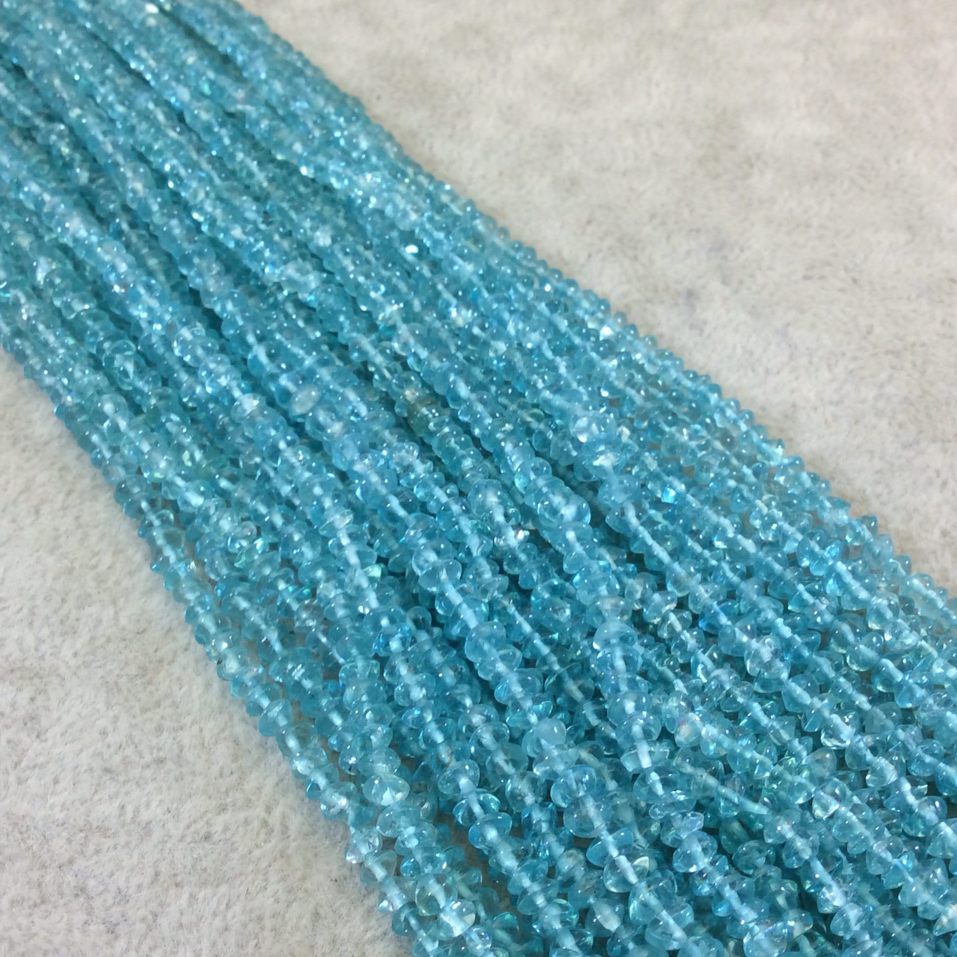 Aqua Apatite Freeform Rondelle Shaped Beads - 3mm X 4mm Approximately Aqua Apatite Freeform Rondelle Shaped Beads - 3mm X 4mm Approximately