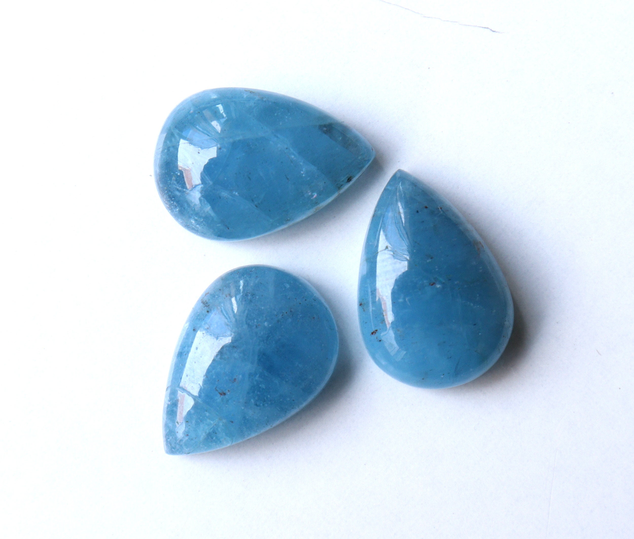 Natural Aquamarine Cabochon Gemstone: Pear Shape, Flat Back Natural Aquamarine Cabochon Gemstone: Pear Shape, Flat Back