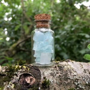 Raw Aquamarine Crystals In A Bottle