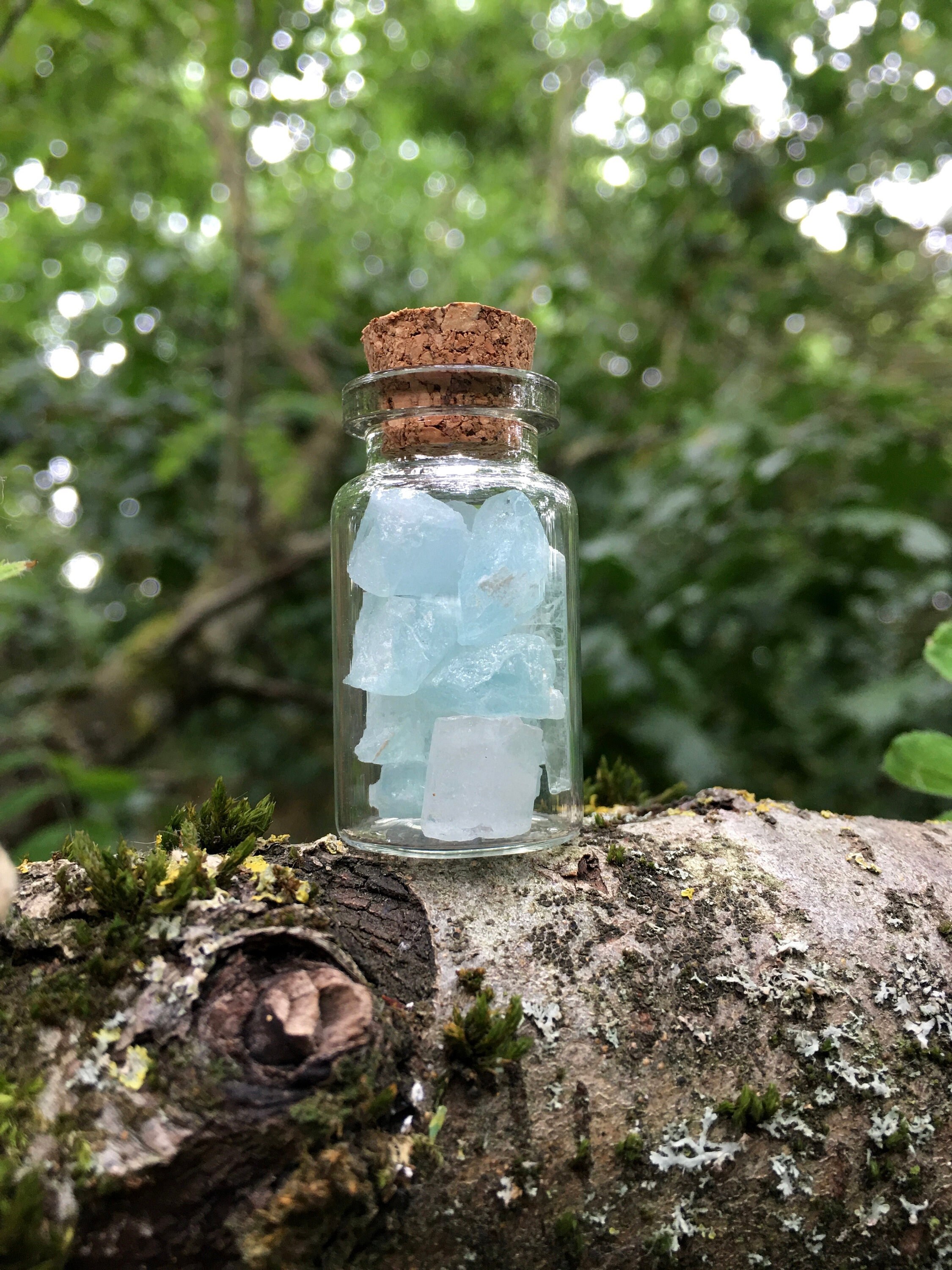 Raw Aquamarine Crystals In A Bottle