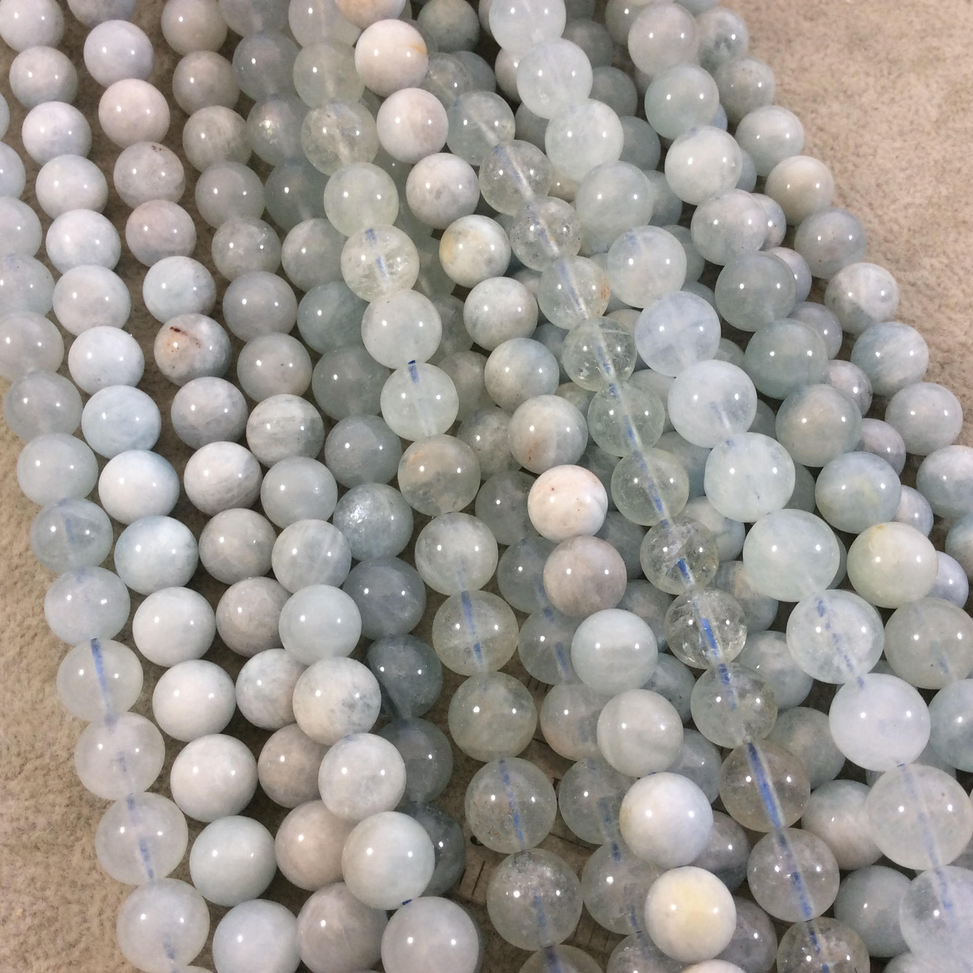 Glossy Aquamarine Round Beads: Natural Light Blue Gemstone Strand
