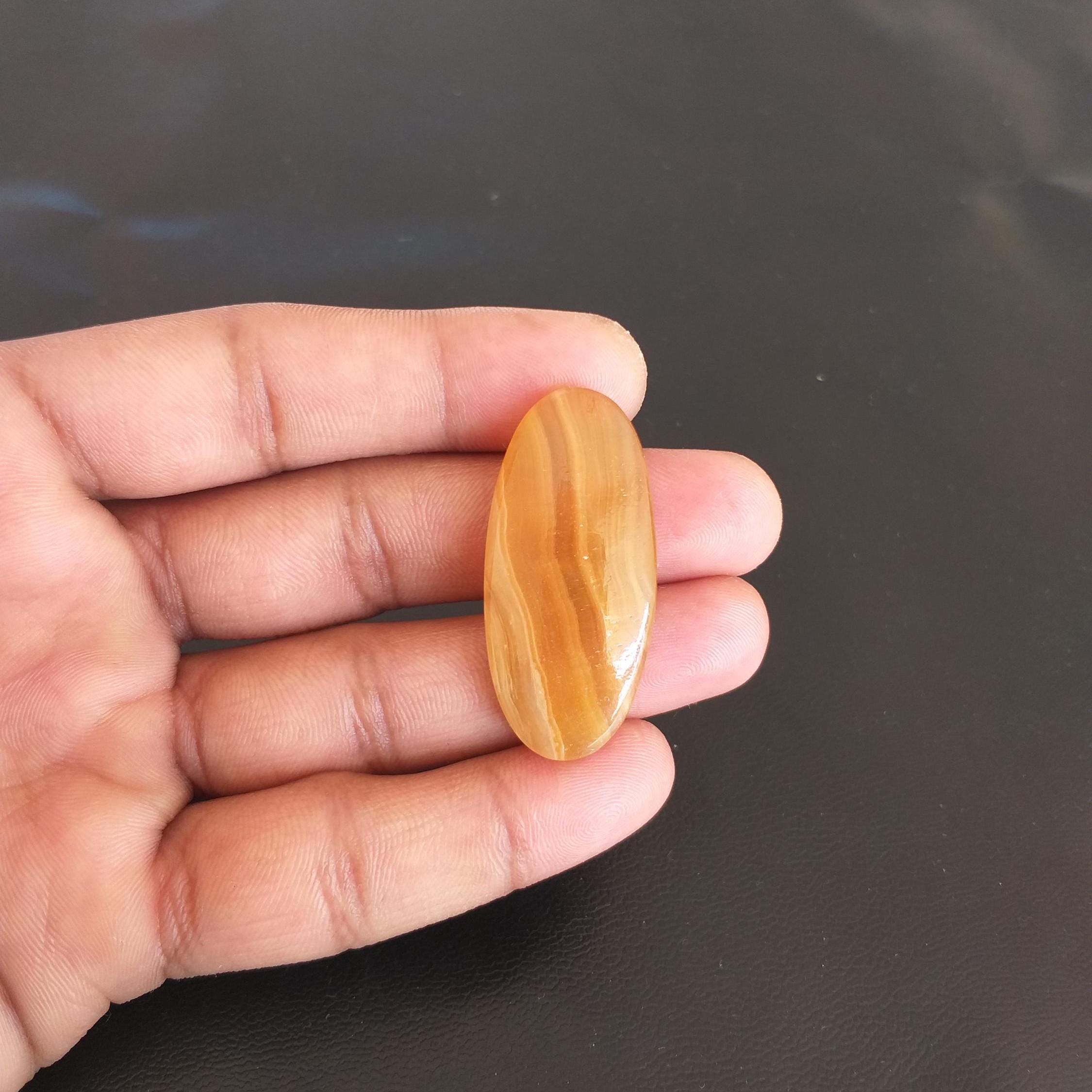 Yellow Aragonite Cabochon: 52.5 Carat Oval Gemstone, 43x20x7mm Yellow Aragonite Cabochon: 52.5 Carat Oval Gemstone, 43x20x7mm