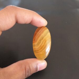 Yellow Aragonite Cabochon: 69.1 Carat Oval Gemstone, 46x25x8 Mm