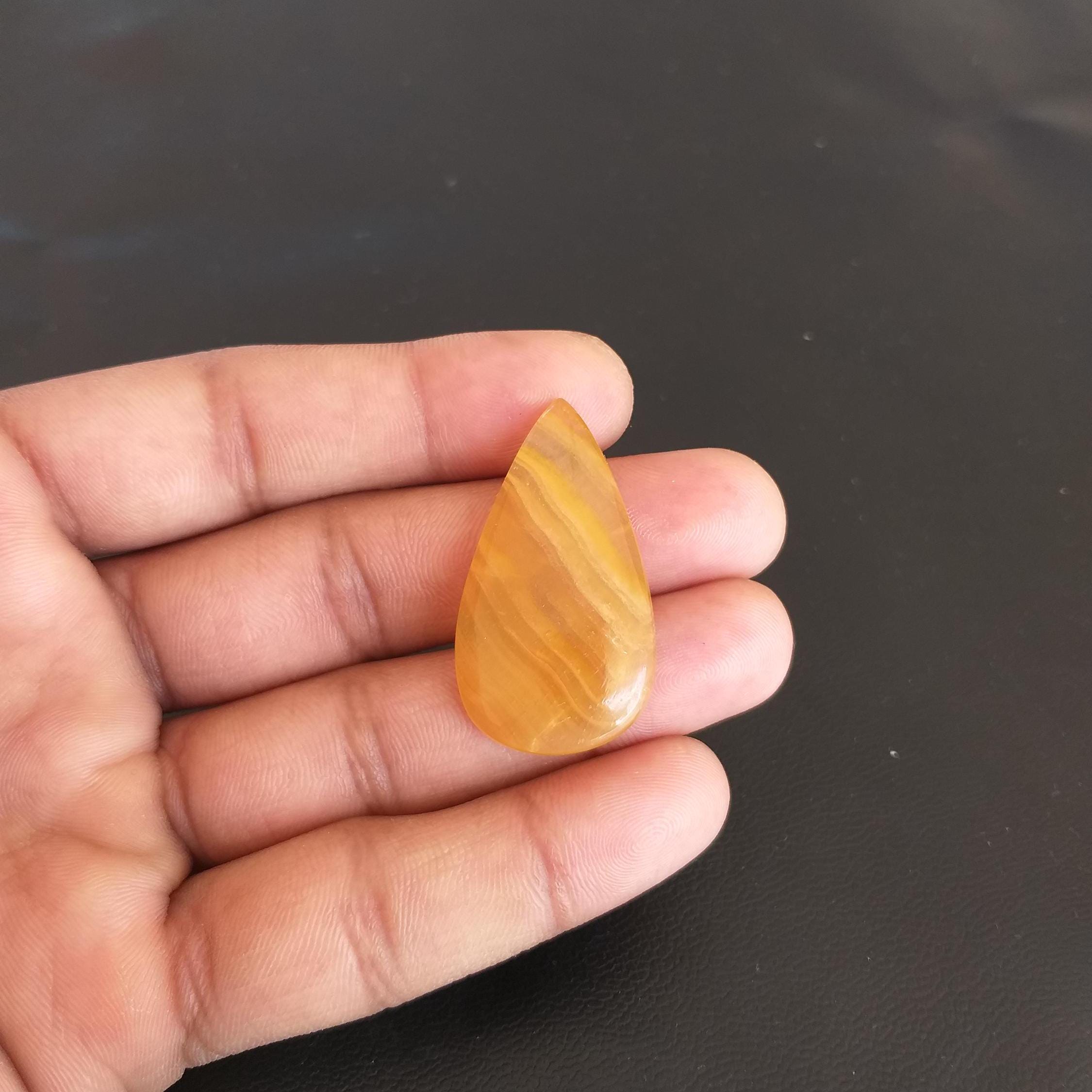 Yellow Aragonite Pear Cabochon: 36.1 Carat Gemstone, 39x22x6 Mm
