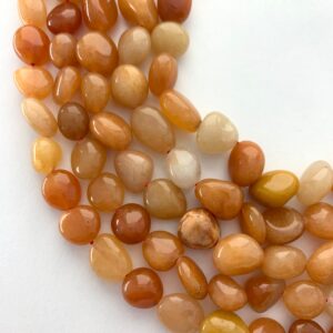10-14mm Peach Aventurine Nugget Gemstone Beads. 15” strand of mixed orange nugget ls, approx. 32-36 beads per strand. Orange Aventurine.