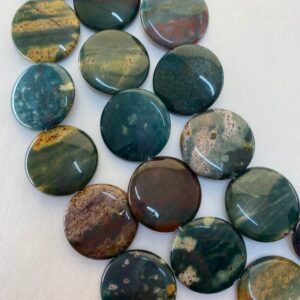 25mm Puff Coin Shaped Dark Green Blood Stone Jasper. Full 15" strand high quality beads in rich green with dabs of red, yellow and blue. 25mm Puff Coin Shaped Dark Green Blood Stone Jasper. Full 15" strand high quality beads in rich green with dabs of red, yellow and blue.