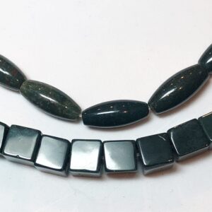 Dark Green Bloodstone Jasper, available in two shapes: 6mm cube and 5x12mm rice. Full 15" strand of deep green beads with specks of red. Dark Green Bloodstone Jasper, available in two shapes: 6mm cube and 5x12mm rice. Full 15" strand of deep green beads with specks of red.