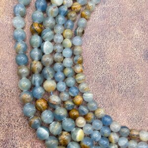 Argentina Lemurian Blue Calcite gemstone beads. 15” strand of round beads, available in 6mm and 8mm.