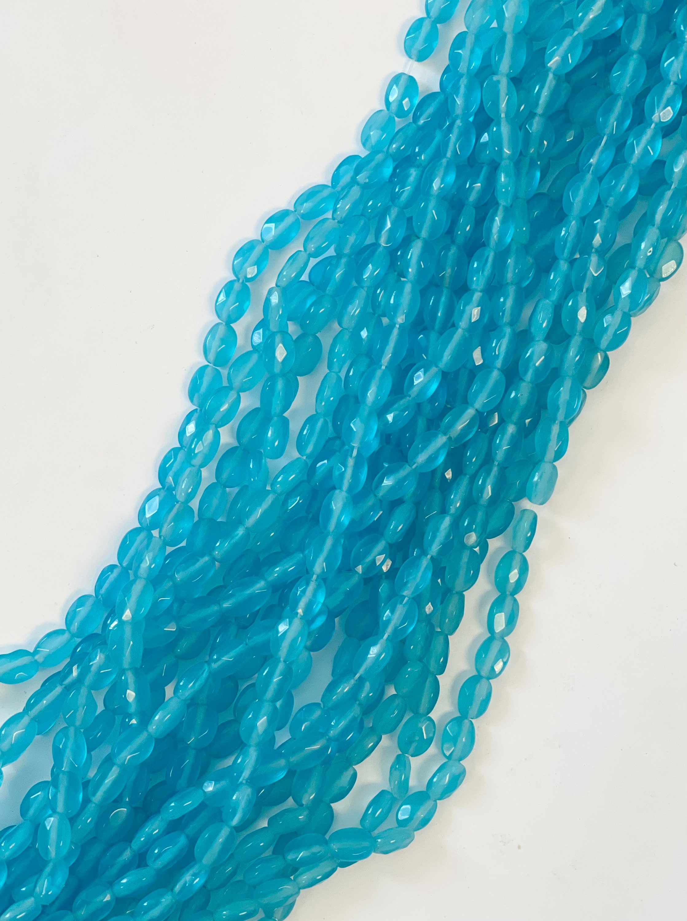 Blue Chalcedony 8x6x4mm Faceted Flat Oval Gemstone Beads--15.5 Inch Strand