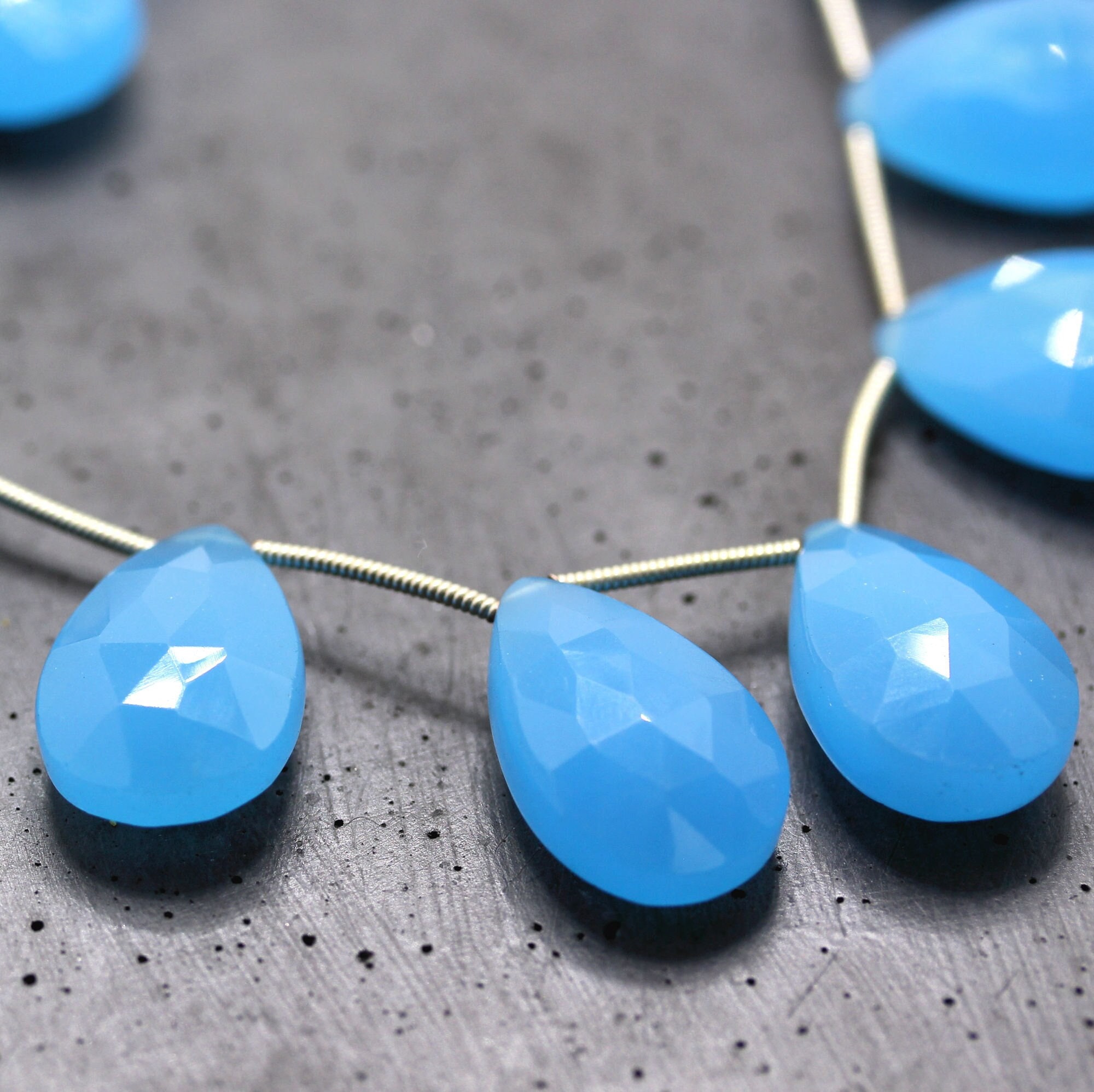 Aqua Blue Chalcedony Teardrop Briolettes: Faceted Gemstone Beads, 8 Inch Strand Aqua Blue Chalcedony Teardrop Briolettes: Faceted Gemstone Beads, 8 Inch Strand