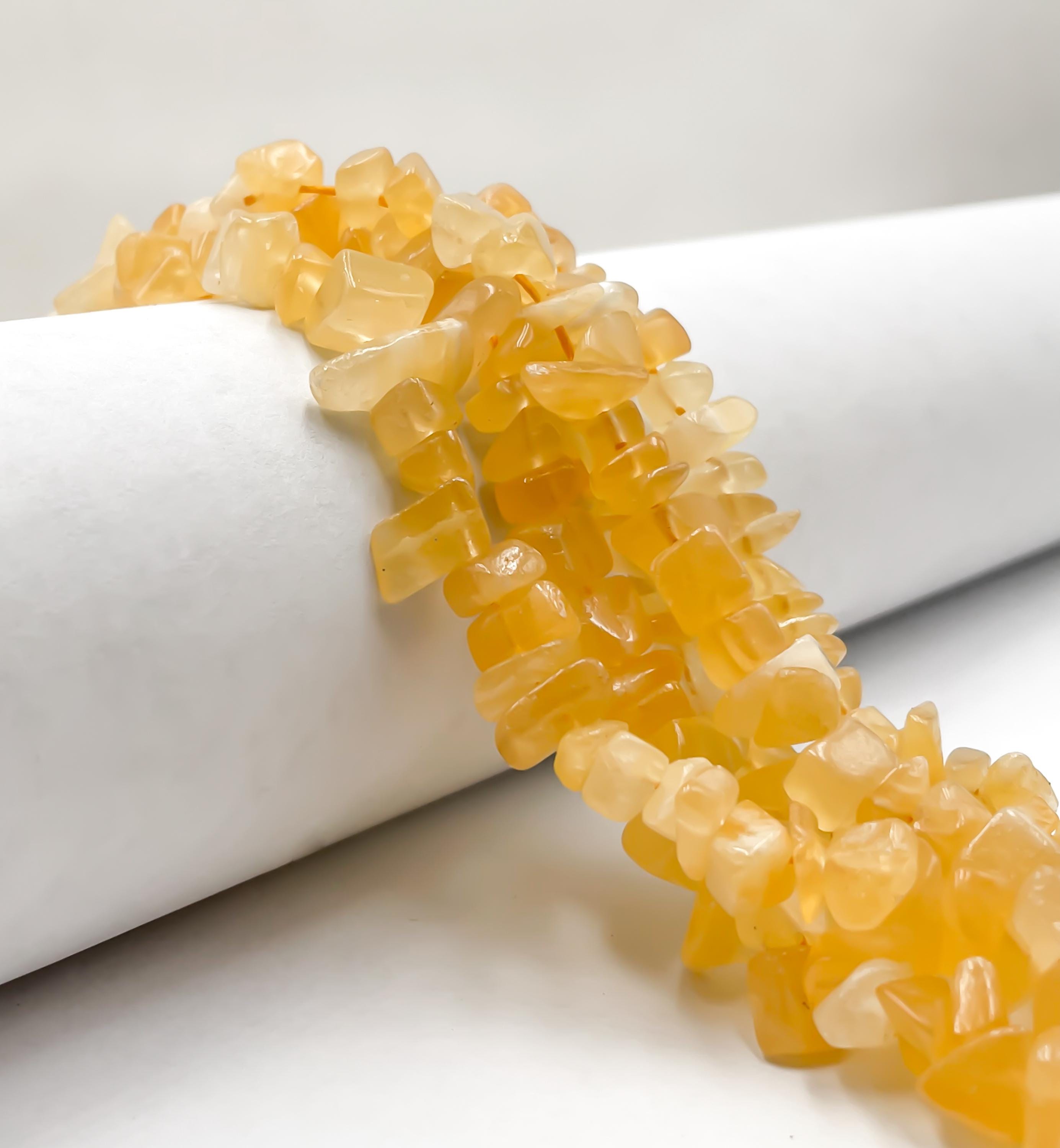 Natural Honey Calcite Irregular Pebble Nugget Chips Approx. 7-8mm 15.5" Strand Natural Honey Calcite Irregular Pebble Nugget Chips Approx. 7-8mm 15.5" Strand