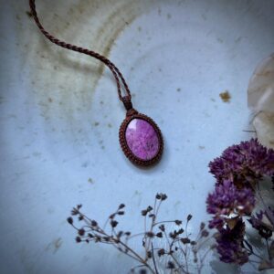 Polished oval shaped Cobalto Calcite stone, wrapped into a necklace with brown macramé cord Polished oval shaped Cobalto Calcite stone, wrapped into a necklace with brown macramé cord