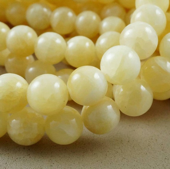 Yellow Calcite Beads (round)(smooth) (4mm)(6mm)(8mm) (10mm)(16"strand)