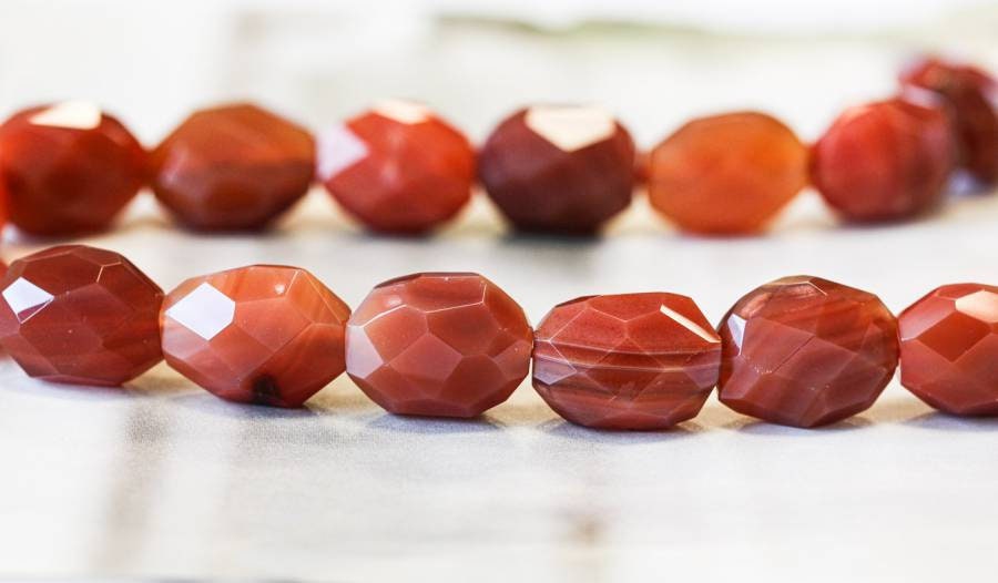 Carnelian 15-16mm Faceted Nugget Beads 16" Strand Size Varies Enhanced Carnelian 15-16mm Faceted Nugget Beads 16" Strand Size Varies Enhanced