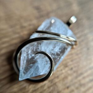 Blue celestite crystal in 14k gold pendant