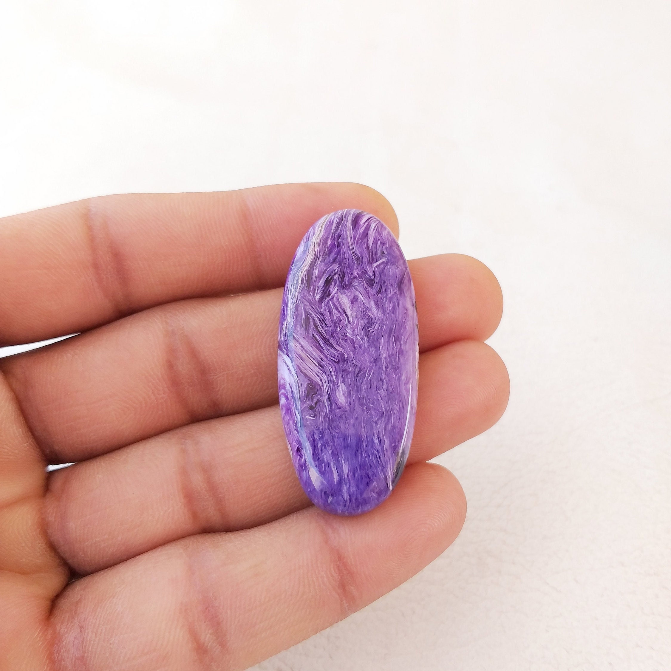 Oval Charoite Cabochon: 48.8 Carat Gemstone Pendant (46x21x6 Mm Oval Charoite Cabochon: 48.8 Carat Gemstone Pendant (46x21x6 Mm