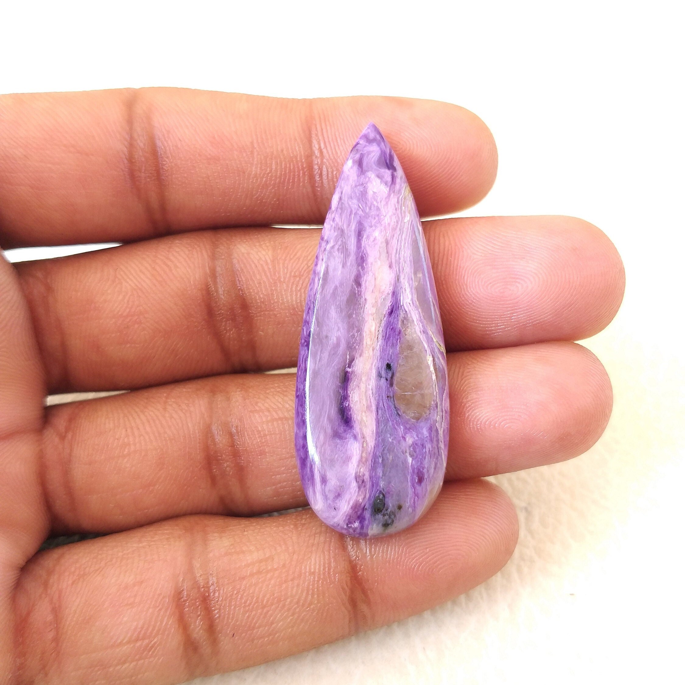 Pear Charoite Cabochon: 49.6 Carat Gemstone, 50x18x7 Mm Pear Charoite Cabochon: 49.6 Carat Gemstone, 50x18x7 Mm
