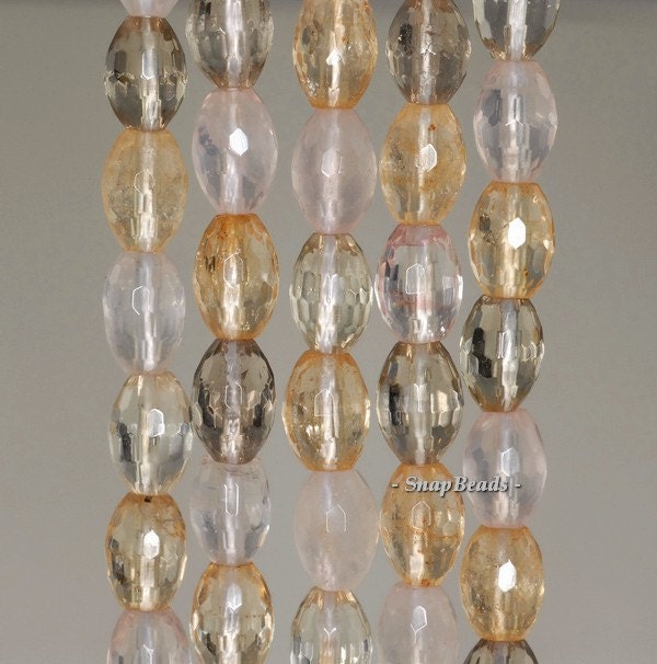 9x6mm Citrine Rose Smoky Mix Quartz Gemstone Faceted Rice Loose Beads 7.5 Inch Half Strand (90191134-b31-558) 9x6mm Citrine Rose Smoky Mix Quartz Gemstone Faceted Rice Loose Beads 7.5 Inch Half Strand (90191134-b31-558)
