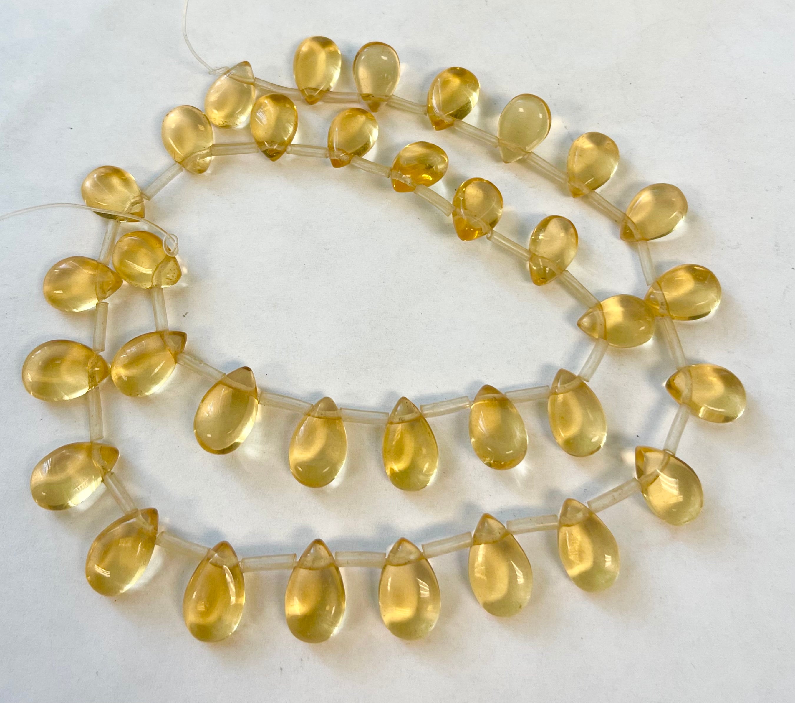 Citrine 12x8x5mm Flat Teardrop Gemstone Beads - 15.5 Inches Strand Citrine 12x8x5mm Flat Teardrop Gemstone Beads - 15.5 Inches Strand
