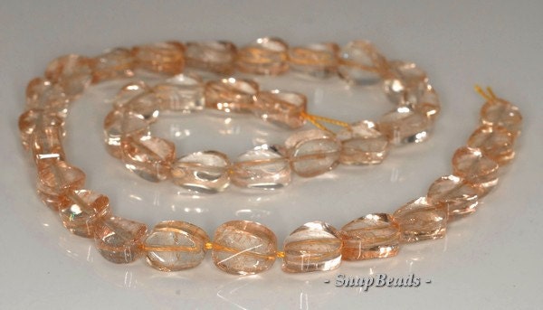 12x9mm Citrine Quartz Gemstone Twist Oval Loose Beads 7.5 Inch Half Strand (90144068-b14-523) 12x9mm Citrine Quartz Gemstone Twist Oval Loose Beads 7.5 Inch Half Strand (90144068-b14-523)