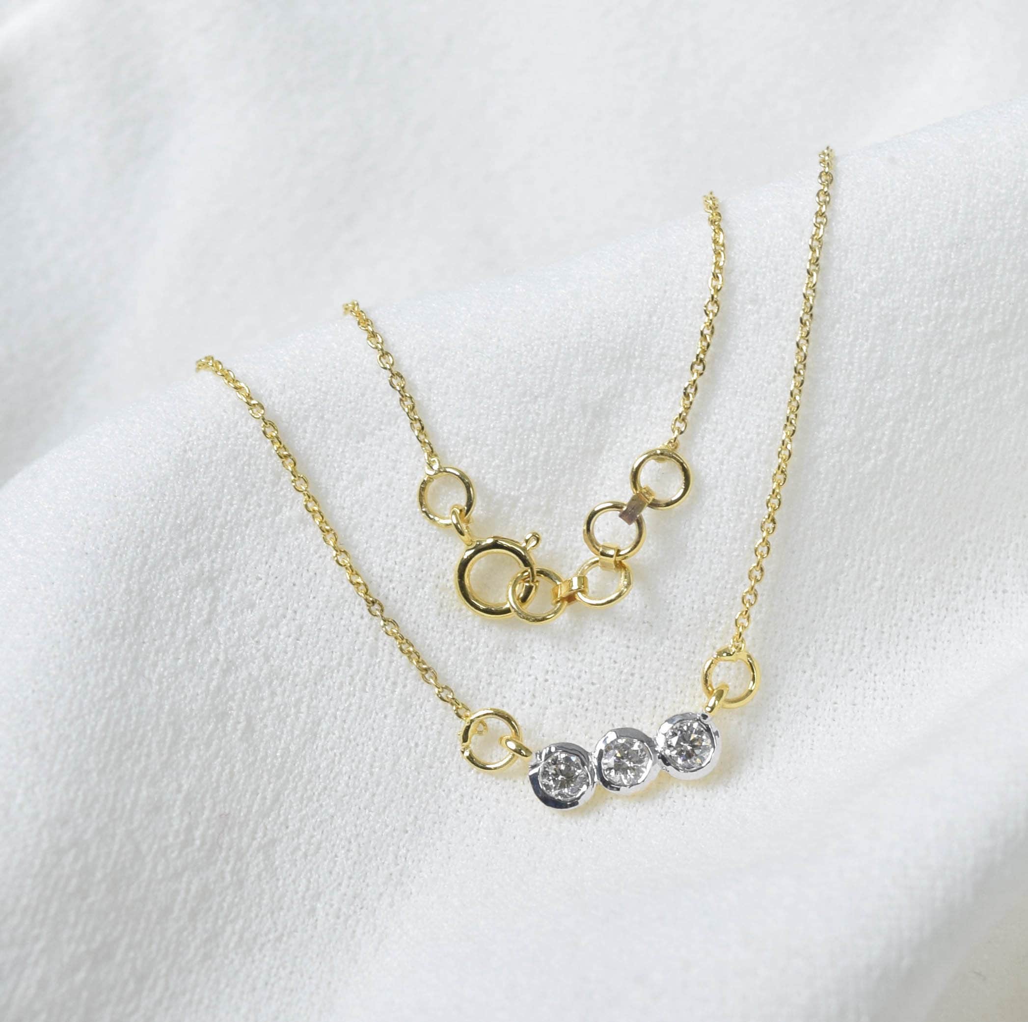 9 Carat Gold Three Diamond Necklace: Delicate Solitaire Pendant