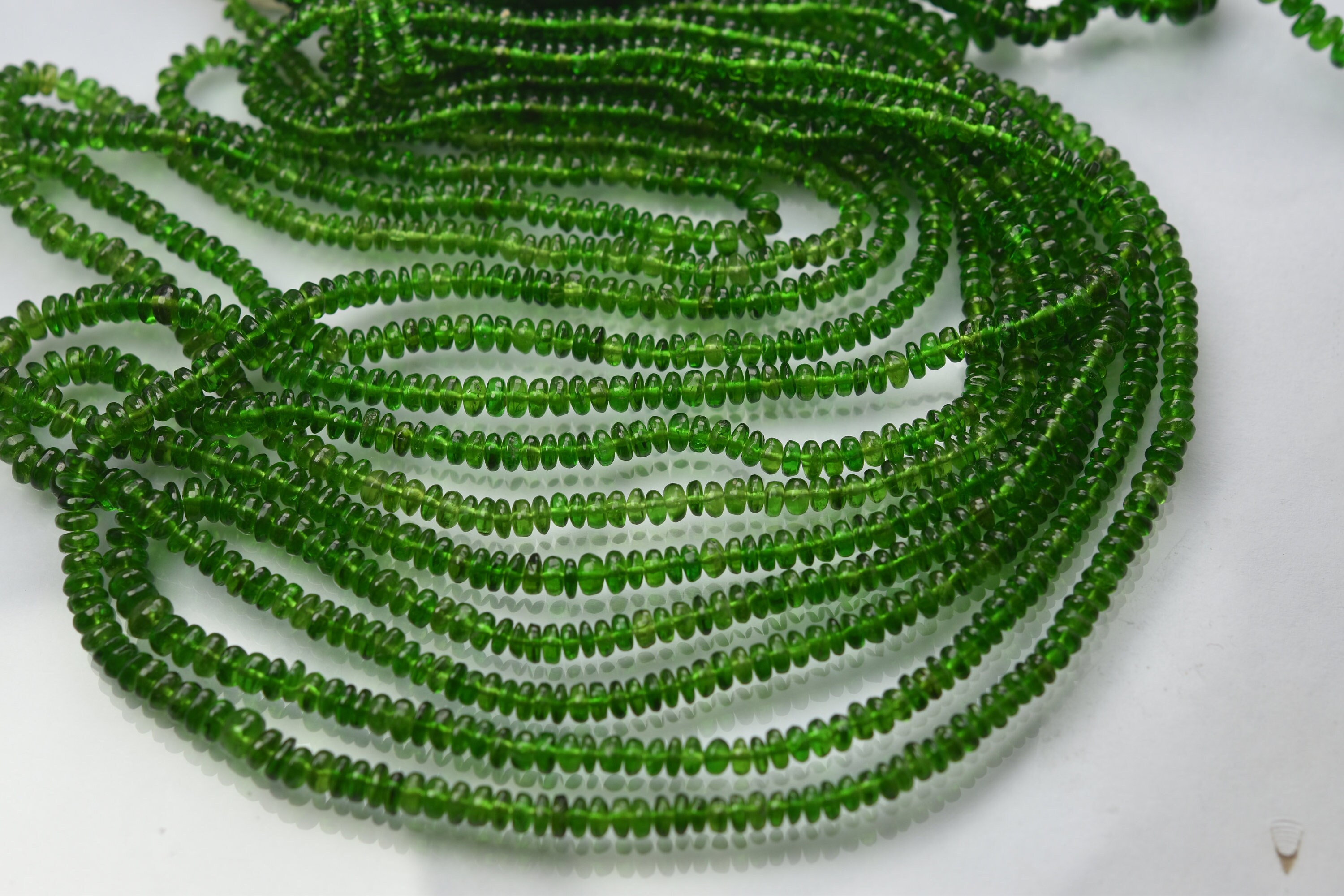 8 Inch Strand, Natural Chrome Diopside Smooth Rondelles. Size 3-4mm 8 Inch Strand, Natural Chrome Diopside Smooth Rondelles. Size 3-4mm