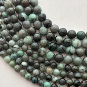 Genuine Emerald gemstone beads. 15” strand of round, mixed green Emerald beads, available in 6-8mm.