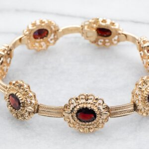 14K Yellow Gold Oval Garnet Bracelet, Ornate January Birthstone 14K Yellow Gold Oval Garnet Bracelet, Ornate January Birthstone
