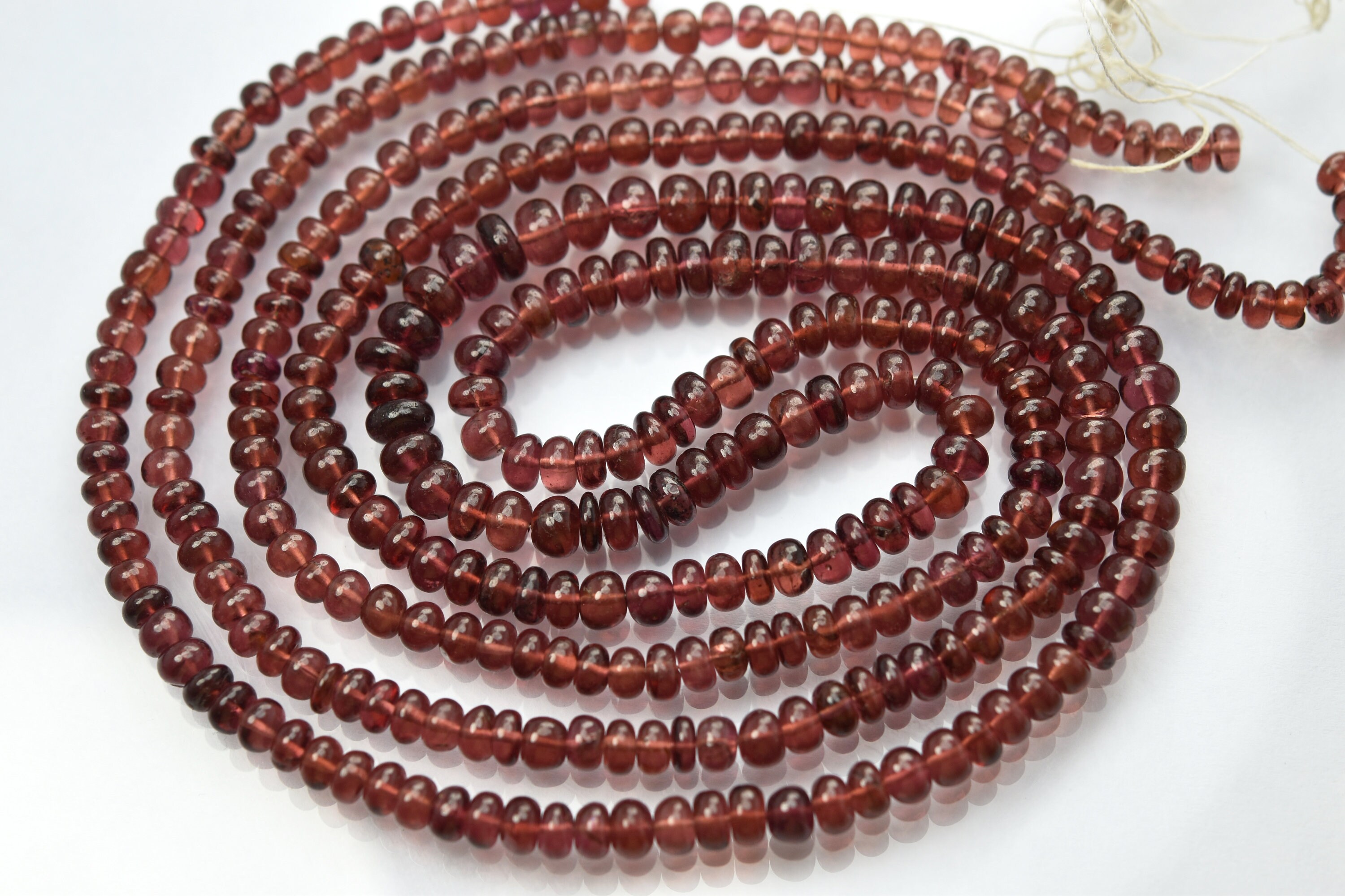 8 Inches Strand, Natural Mozambique Garnet Smooth Rondelles. Size 4-5.5mm 8 Inches Strand, Natural Mozambique Garnet Smooth Rondelles. Size 4-5.5mm