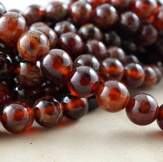 Hessonite Garnet (round)(smooth)(6mm)(8mm)(10mm)(16"strand)