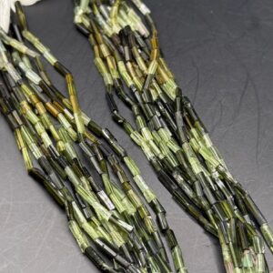 Full strand of green tourmaline faceted tubes Full strand of green tourmaline faceted tubes