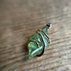 Faceted green tourmaline in 14k gold pendant Faceted green tourmaline in 14k gold pendant