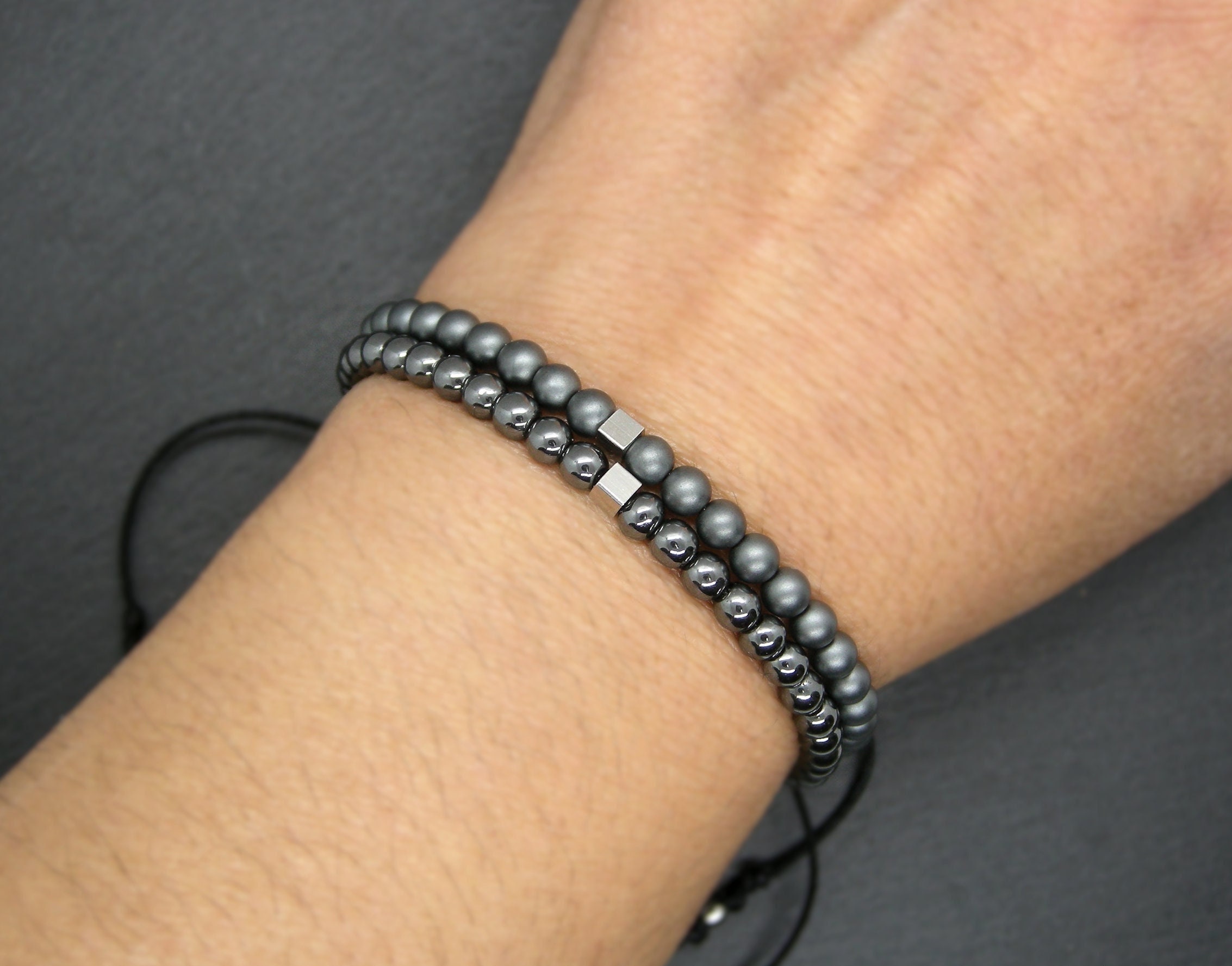 Hematite Bracelet: Unisex Adjustable Wristband With Stainless Steel Cube, Matte Or Glossy Stones Hematite Bracelet: Unisex Adjustable Wristband With Stainless Steel Cube, Matte Or Glossy Stones