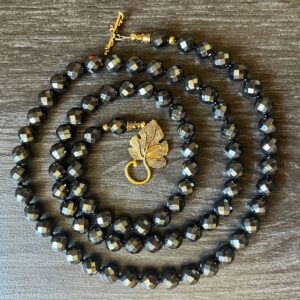 Handmade 39" Hematite Necklace: Faceted Black Gemstone, Gold Leaf Clasp Handmade 39" Hematite Necklace: Faceted Black Gemstone, Gold Leaf Clasp
