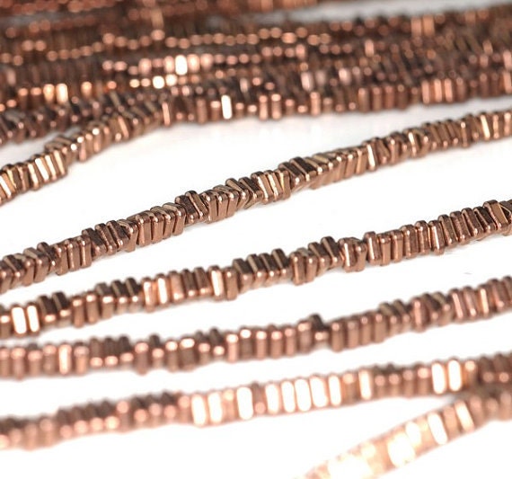 3x1mm Bronze Hematite Gemstone Heishi Triangle Slice 3x1mm Loose Beads 16 Inch Full Strand Lot 1,2,6,12 And 50 (90185575-837) 3x1mm Bronze Hematite Gemstone Heishi Triangle Slice 3x1mm Loose Beads 16 Inch Full Strand Lot 1,2,6,12 And 50 (90185575-837)