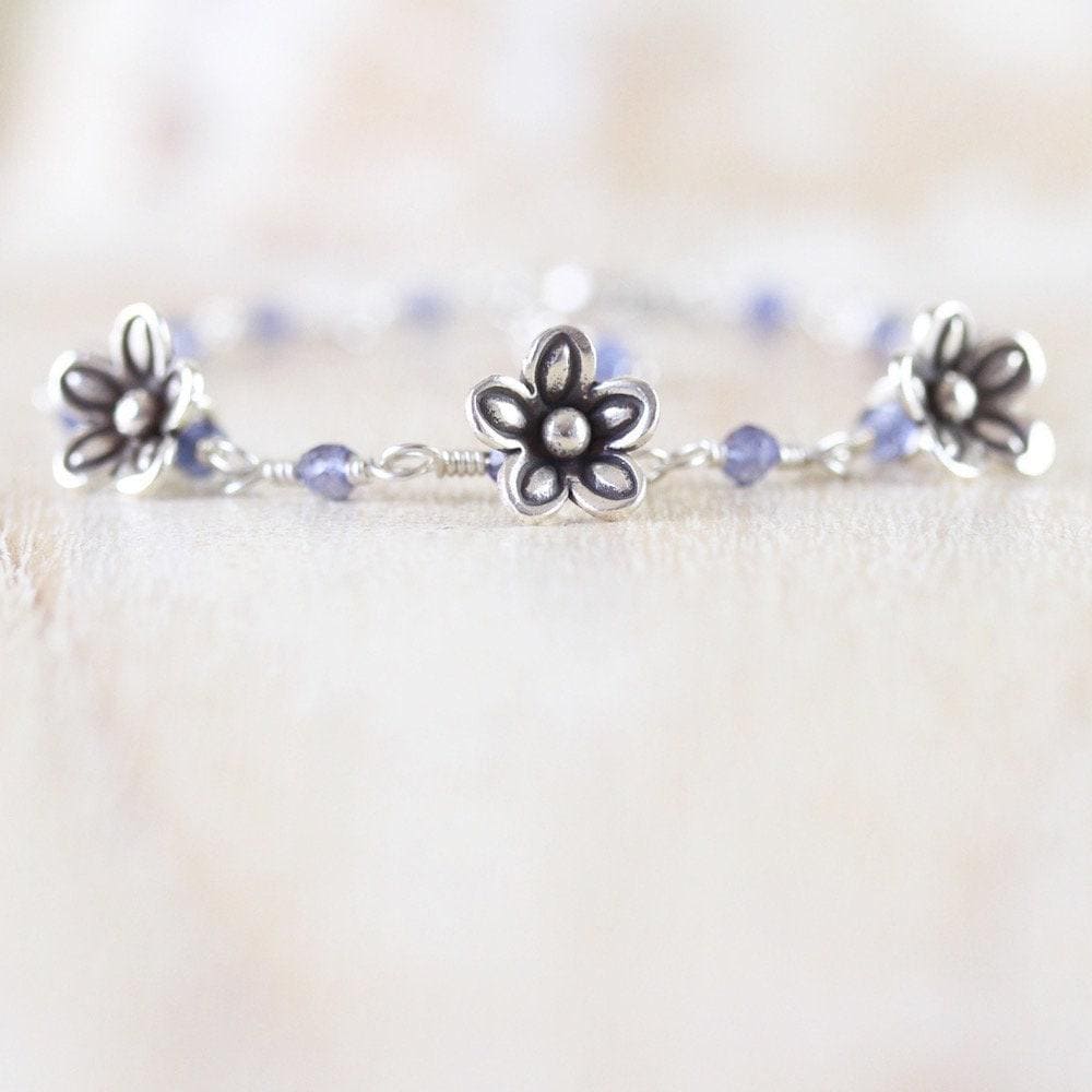 Iolite, Sterling & Fine Silver Bracelet With Karen Hill Tribe Flower Charms, Dainty Blue Iolite Gemstone And Wire Wrapped Rosary Chain Iolite, Sterling & Fine Silver Bracelet With Karen Hill Tribe Flower Charms, Dainty Blue Iolite Gemstone And Wire Wrapped Rosary Chain