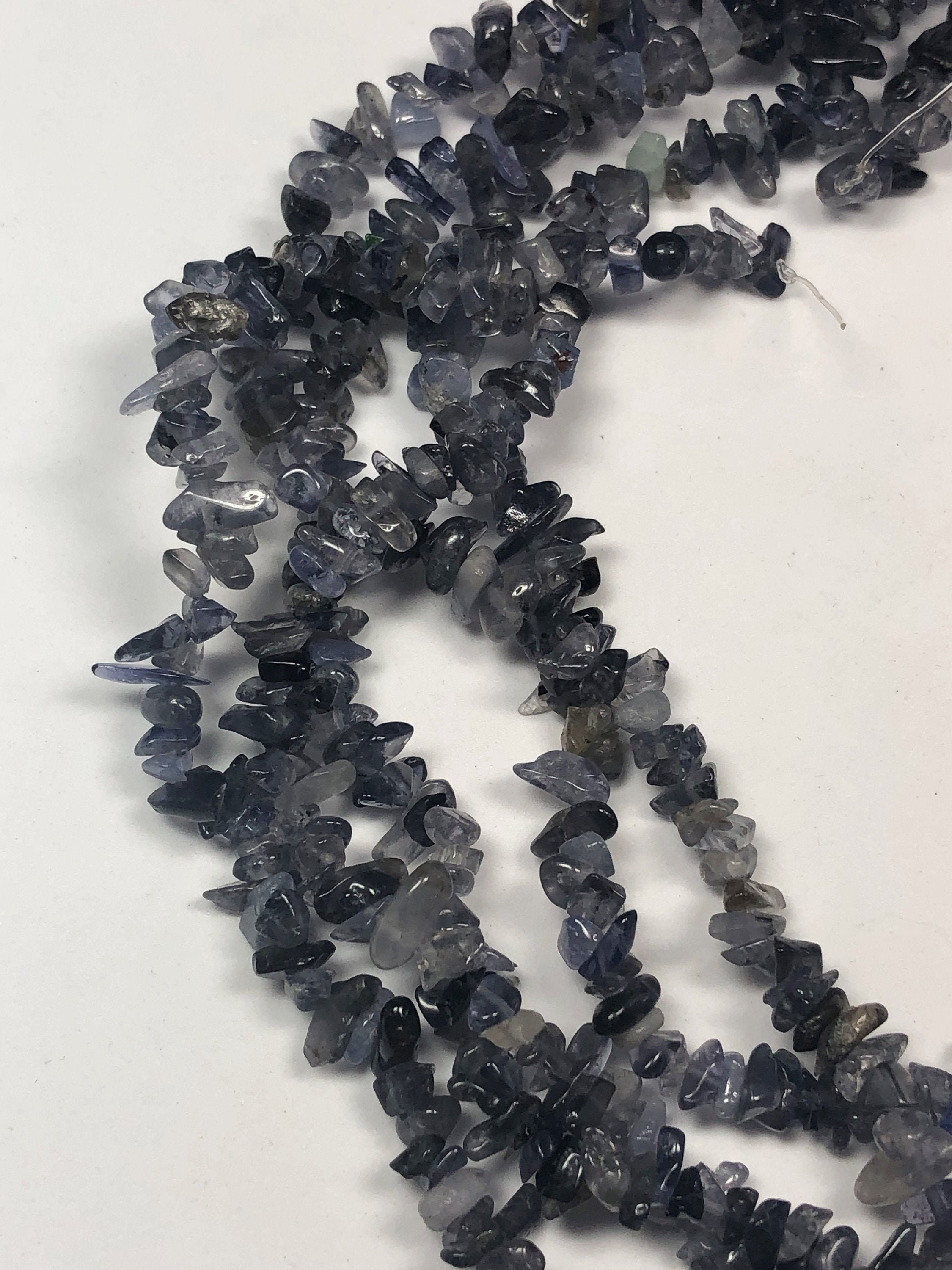 Iolite Gemstone Chips. Full 16" Strand Of Iolite Beads, Approx. 4-8mm In Size. A Mix Of Light And Dark Grayish-blue Chips.